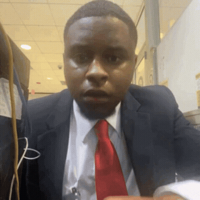 Man In Suit And Tie Surprised At Camera GIF