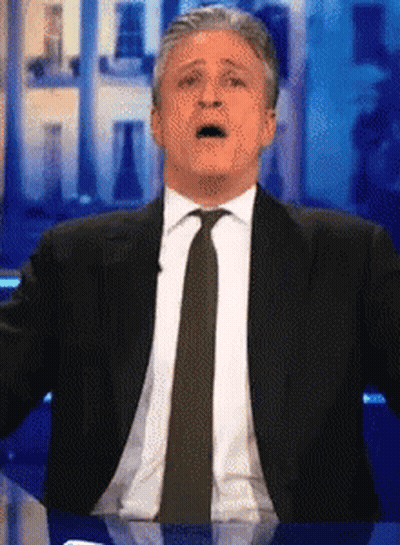 Man In Suit And Tie Surprised Face GIF