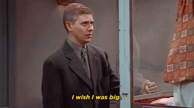 Man In Suit And Tie Talking In Front Of Window GIF