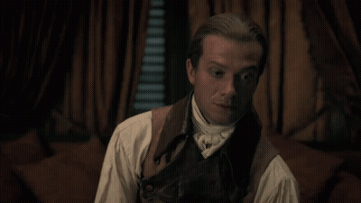 Man In Suit And Tie Talking Into Microphone GIF