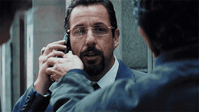 Man In Suit And Tie Talking On Cellphone GIF