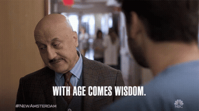 Man In Suit And Tie Talking To Another Man With Age Comes Wisdom GIF