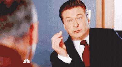 Man In Suit And Tie Talking To Woman At Mirror GIF