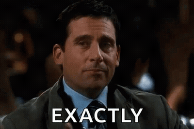 Man In Suit And Tie Toasting With Drink GIF