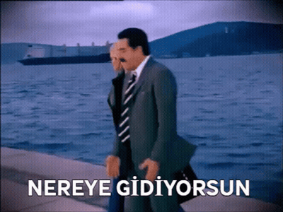 Man In Suit And Tie Walking By Water Nereye Gidiyorsun GIF