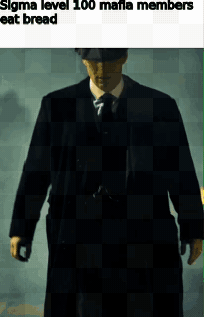Man In Suit And Tie Walking In Dark GIF