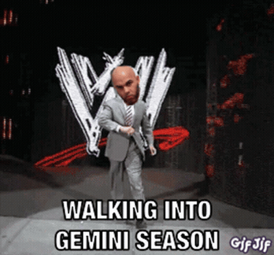 Man In Suit And Tie Walking Into Gemini Season GIF