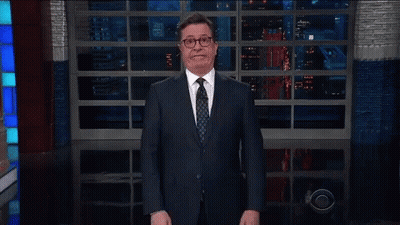Man In Suit And Tie Walking Past CBS Logo GIF