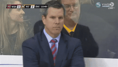 Man In Suit And Tie Watching Hockey GIF