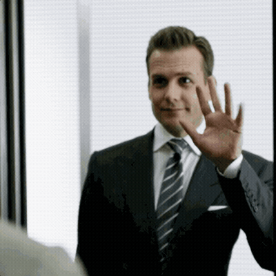 Man In Suit And Tie Waving GIF