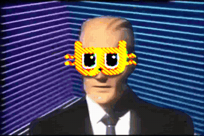 Man In Suit And Tie Wearing Cat Mask GIF