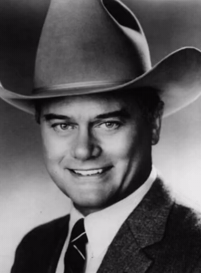 Man In Suit And Tie Wearing Cowboy Hat GIF