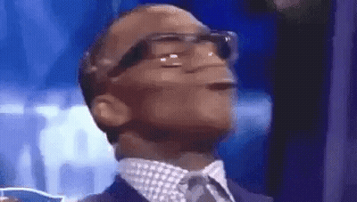 Man In Suit And Tie Wearing Glasses GIF