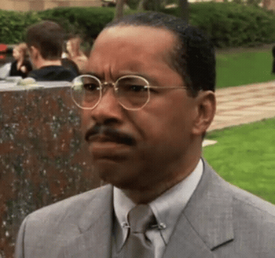 Man In Suit And Tie Wearing Glasses GIF