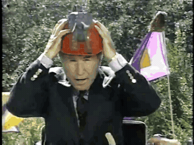 Man In Suit And Tie Wearing Hard Hat GIF