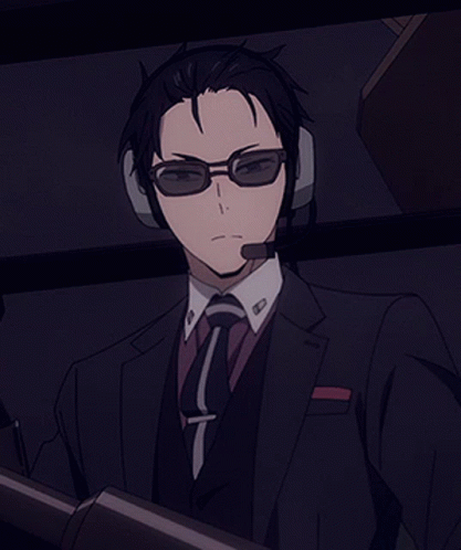 Man In Suit And Tie Wearing Headphones And Glasses GIF