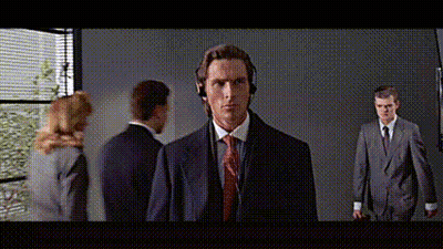 Man In Suit And Tie Wearing Headphones In Front Of Group GIF
