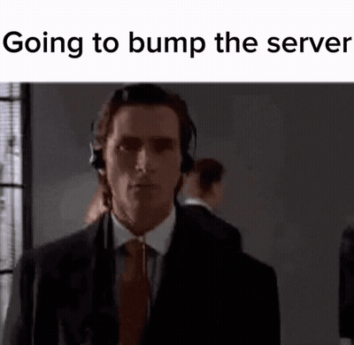 Man In Suit And Tie Wearing Headphones Looking At Camera GIF