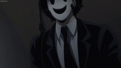 Man In Suit And Tie Wearing Mask GIF