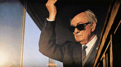 Man In Suit And Tie Wearing Sunglasses GIF