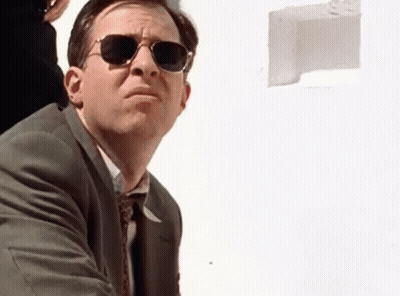 Man In Suit And Tie Wearing Sunglasses Looking Up GIF
