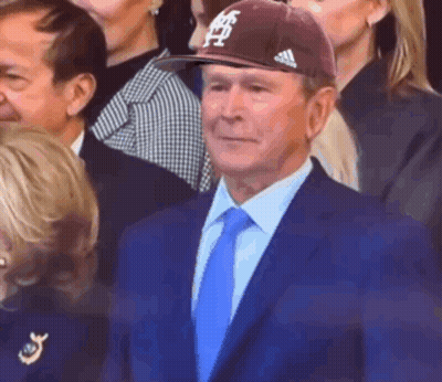 Man In Suit And Tie Wearing Texas Hat GIF
