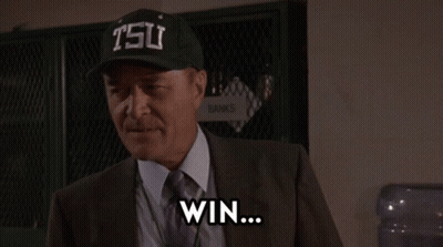 Man In Suit And Tie Wearing Tsu Hat GIF