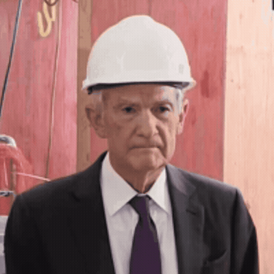 Man In Suit And Tie Wearing White Hard Hat GIF