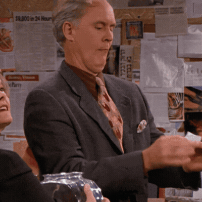 Man In Suit And Tie With $9000 Sign GIF
