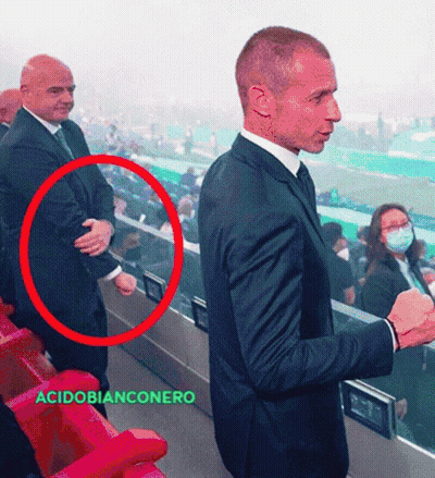 Man In Suit And Tie With Acidobianconero Red Circle GIF