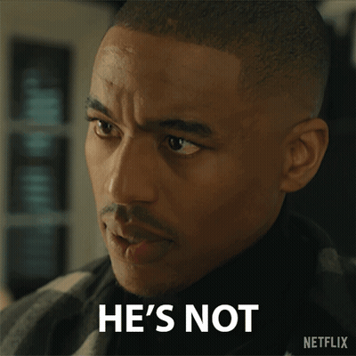 Man In Suit And Tie With America Is Back Sign GIF