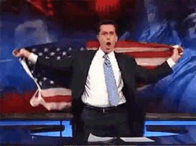 Man In Suit And Tie With American Flag GIF
