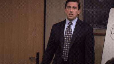 Man In Suit And Tie With Arms Outstretched GIF