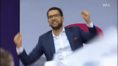 Man In Suit And Tie With Arms Outstretched GIF