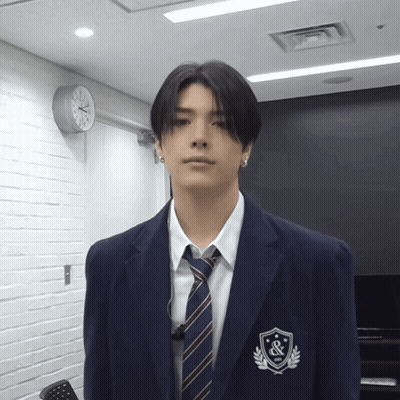 Man In Suit And Tie With Badge GIF