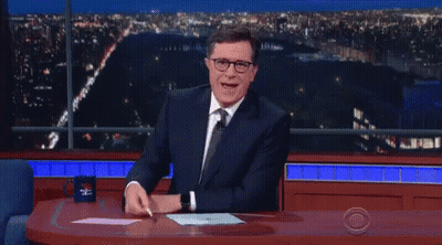 Man In Suit And Tie With CBS Mug GIF