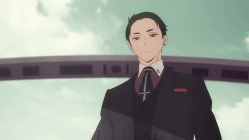 Man In Suit And Tie With Cross GIF