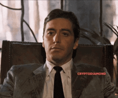 Man In Suit And Tie With Cryptodiamond Above GIF
