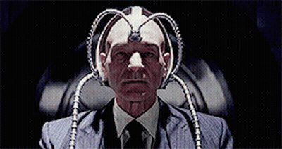 Man In Suit And Tie With Device On Head GIF