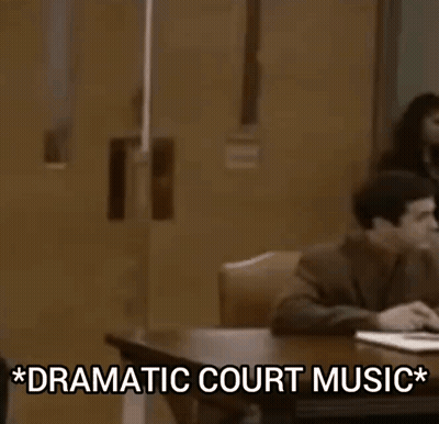 Man In Suit And Tie With Dramatic Court Music GIF