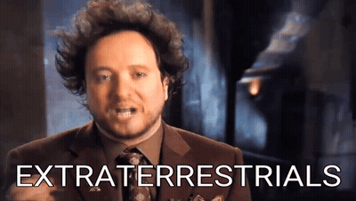 Man In Suit And Tie With Extraterrestrials GIF