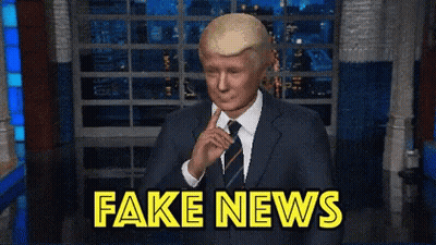 Man In Suit And Tie With Fake News GIF
