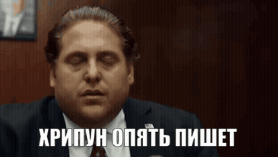 Man In Suit And Tie With Foreign Language On Face GIF