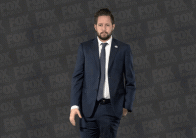 Man In Suit And Tie With Fox Ad GIF