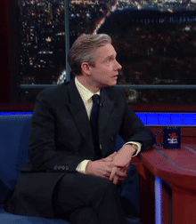 Man In Suit And Tie With Fox News Mug GIF