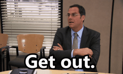 Man In Suit And Tie With Get Out Sign GIF