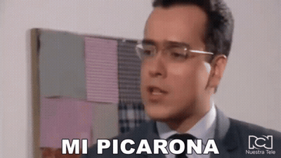 Man In Suit And Tie With Glasses Says Mi Picarona GIF