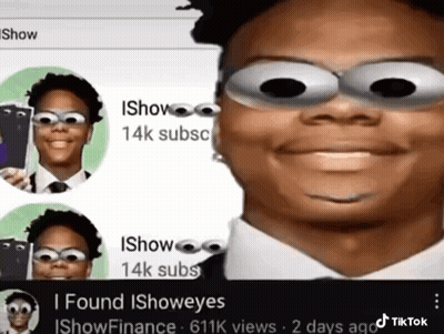 Man In Suit And Tie With Googly Eyes Smiling GIF