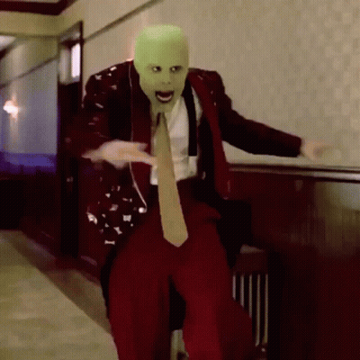 Man In Suit And Tie With Green Mask GIF