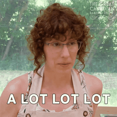 Man In Suit And Tie With Group At Mansion GIF